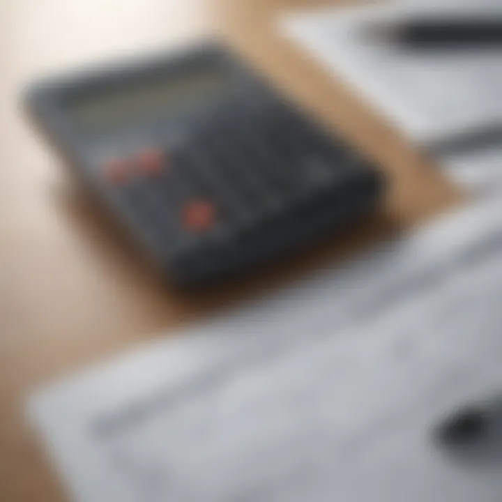 A close-up of financing documents and a calculator on a table