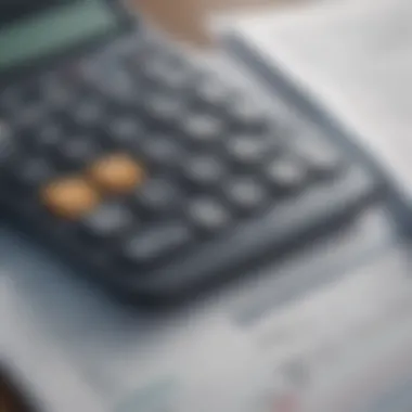 Close-up of a calculator with financial documents showcasing loan comparisons